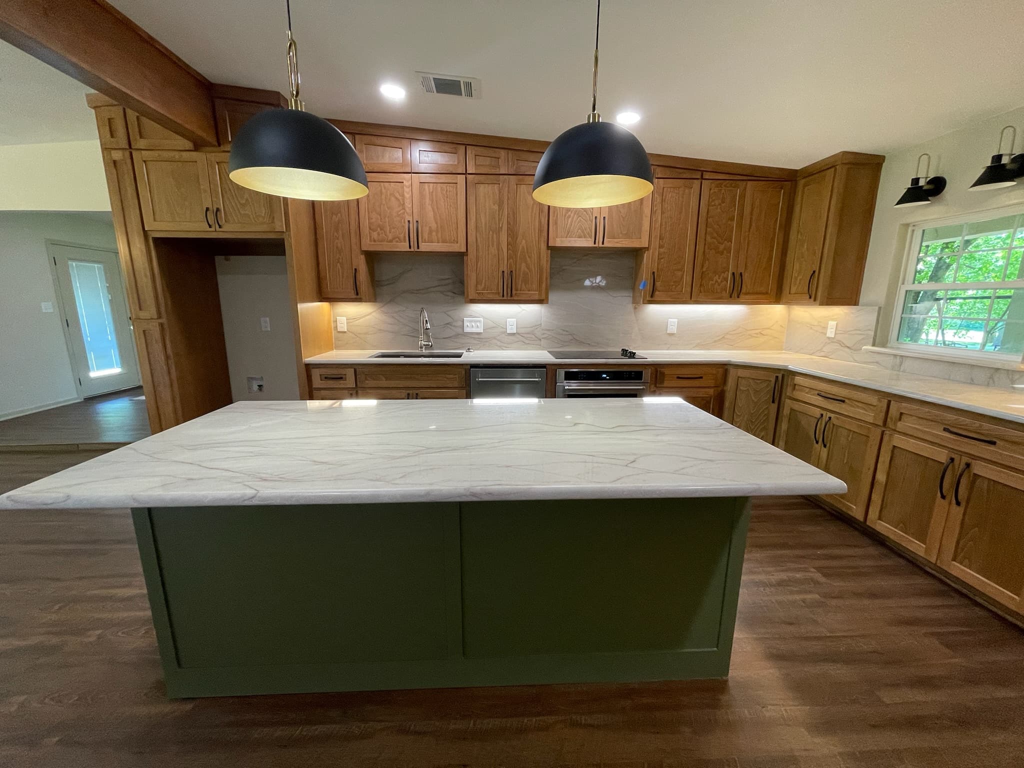 Barnes kitchen after renovation — natural wood cabinets with sage island